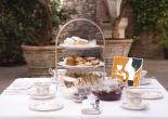 Hotel courtyard with Tea Guild Award and afternoon tea.